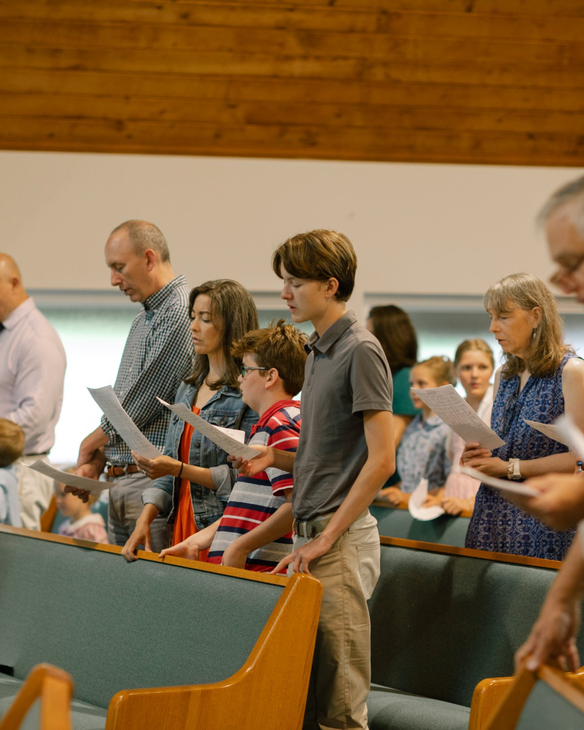 The congregation singing together during the Sunday liturgy.