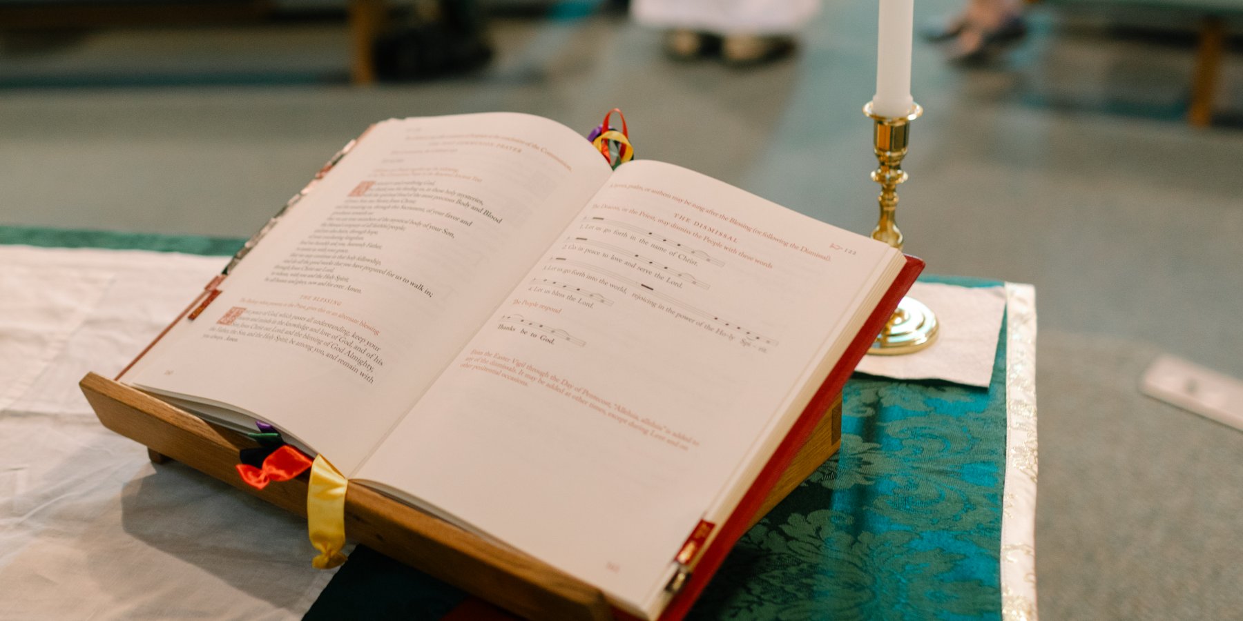 The altar book at St. Andrew's, open to The Dismissal — 'Let us go forth in the name of Christ.'